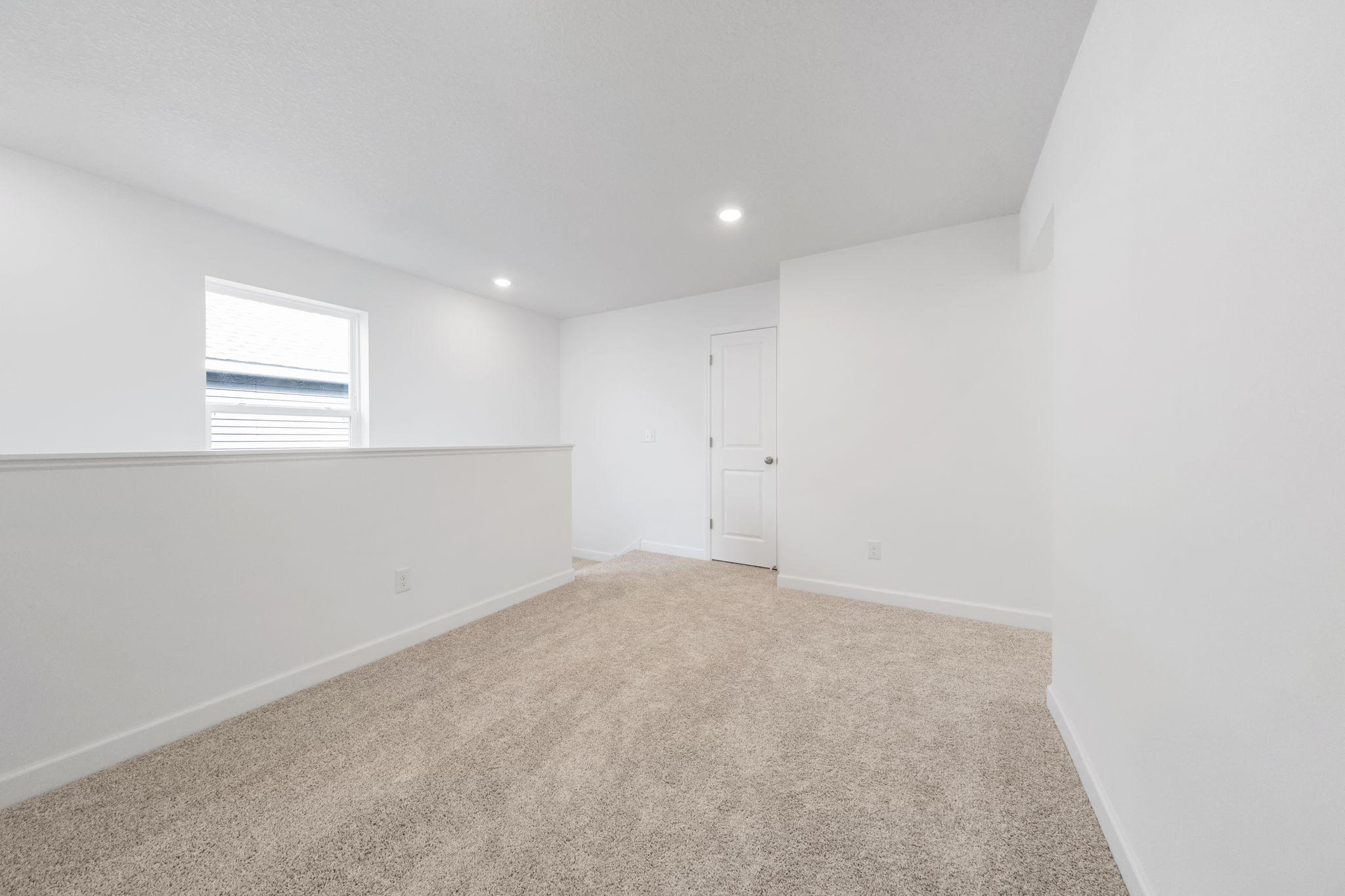 (Photo of a very similar home, actual finishes may vary)