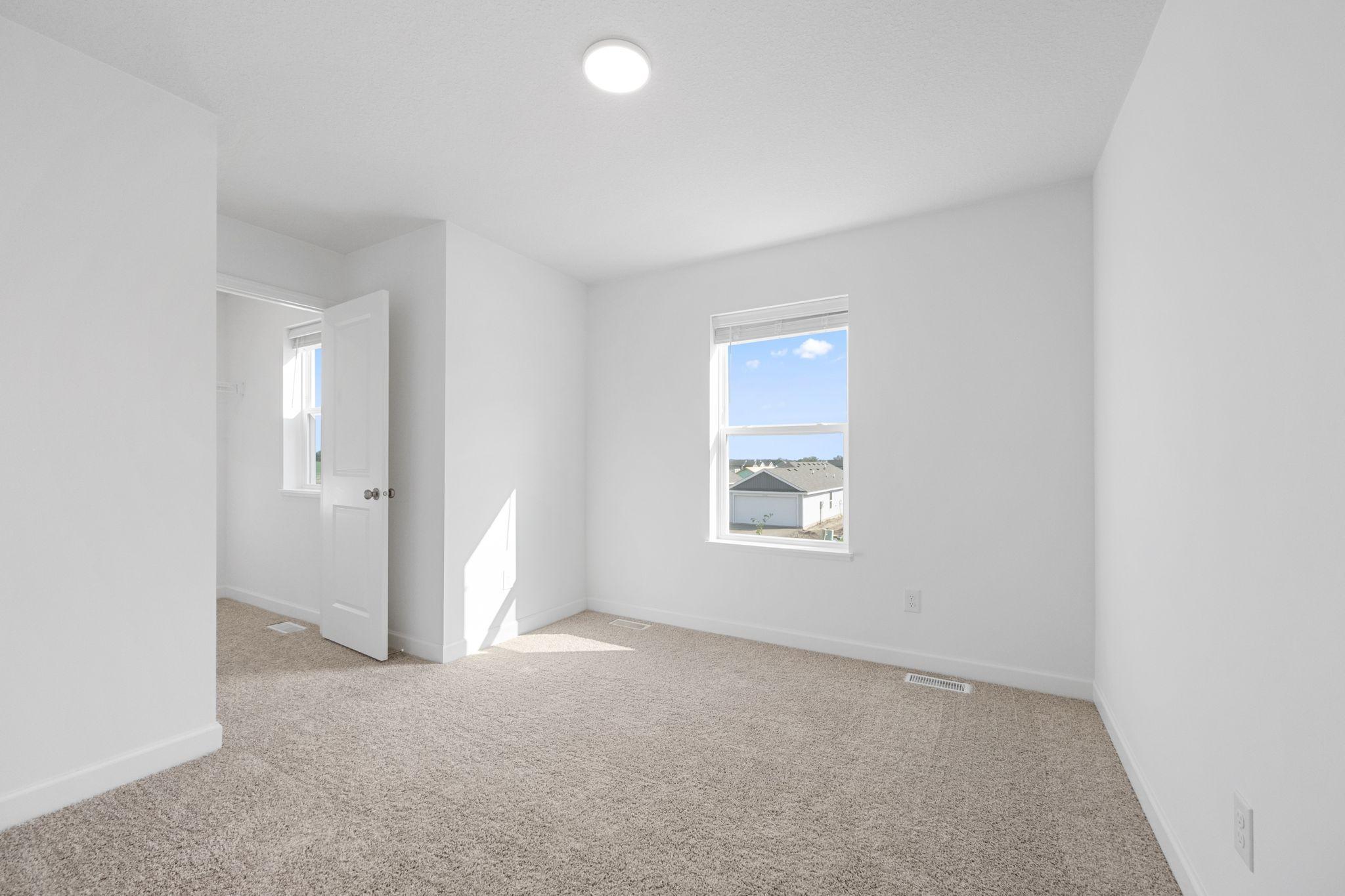 (Photo of a very similar home, actual finishes may vary)
