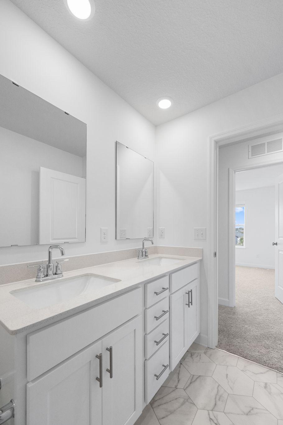 (Photo of a very similar home, actual finishes may vary)