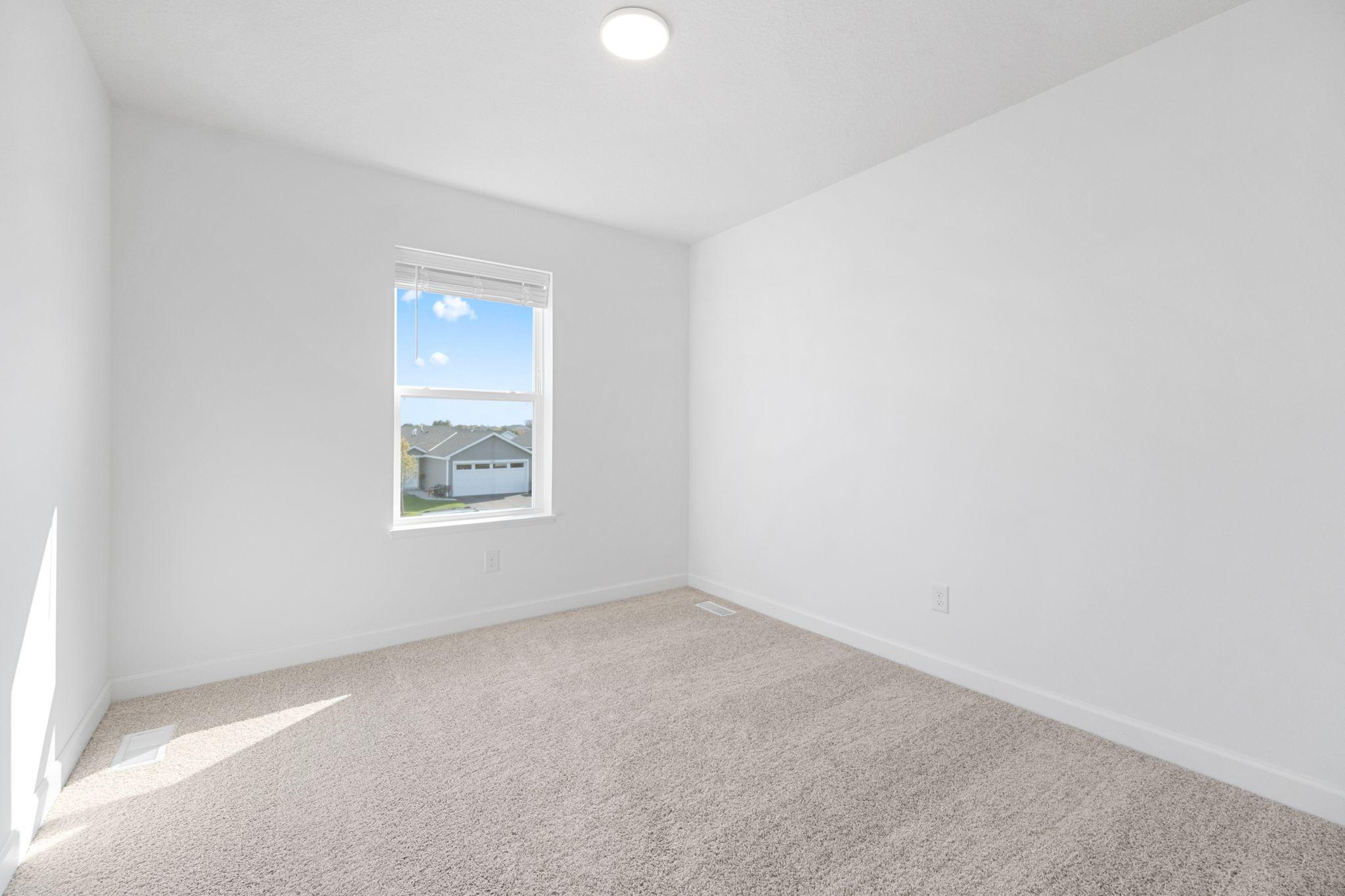(Photo of a very similar home, actual finishes may vary)