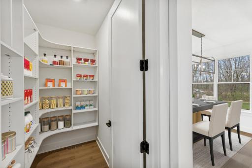 (Photo of an inventory home, actual homes finishes will vary) The kitchen pantry.