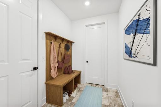 (Photo of an inventory home, actual homes finishes will vary) The mudroom comes with this helpful built in.
