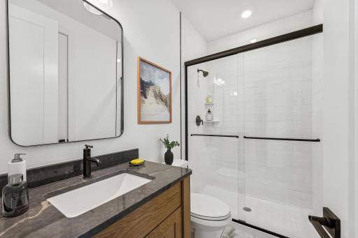 (Photo of an inventory home, actual homes finishes will vary) The main level bath.