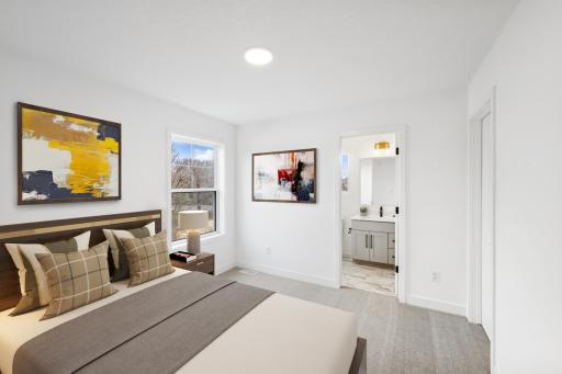(Photo of an inventory home, actual homes finishes will vary) One of three upper level secondary bedrooms.