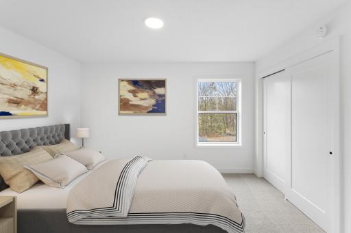 (Photo of an inventory home, actual homes finishes will vary) One of the three secondary bedrooms on the upper level.