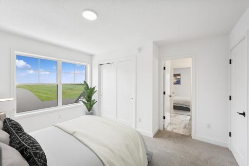 (Photo of an inventory home, actual homes finishes will vary) One of three upper level secondary bedrooms.