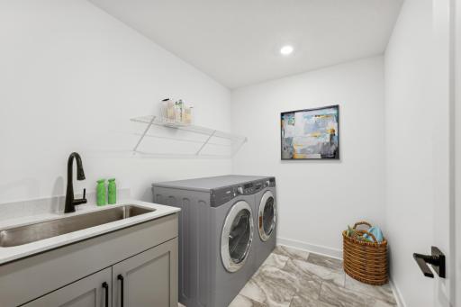 (Photo of an inventory home, actual homes finishes will vary) Upper level laundry!
