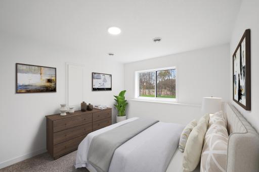 (Photo of an inventory home, actual homes finishes will vary) The lower level bedroom.