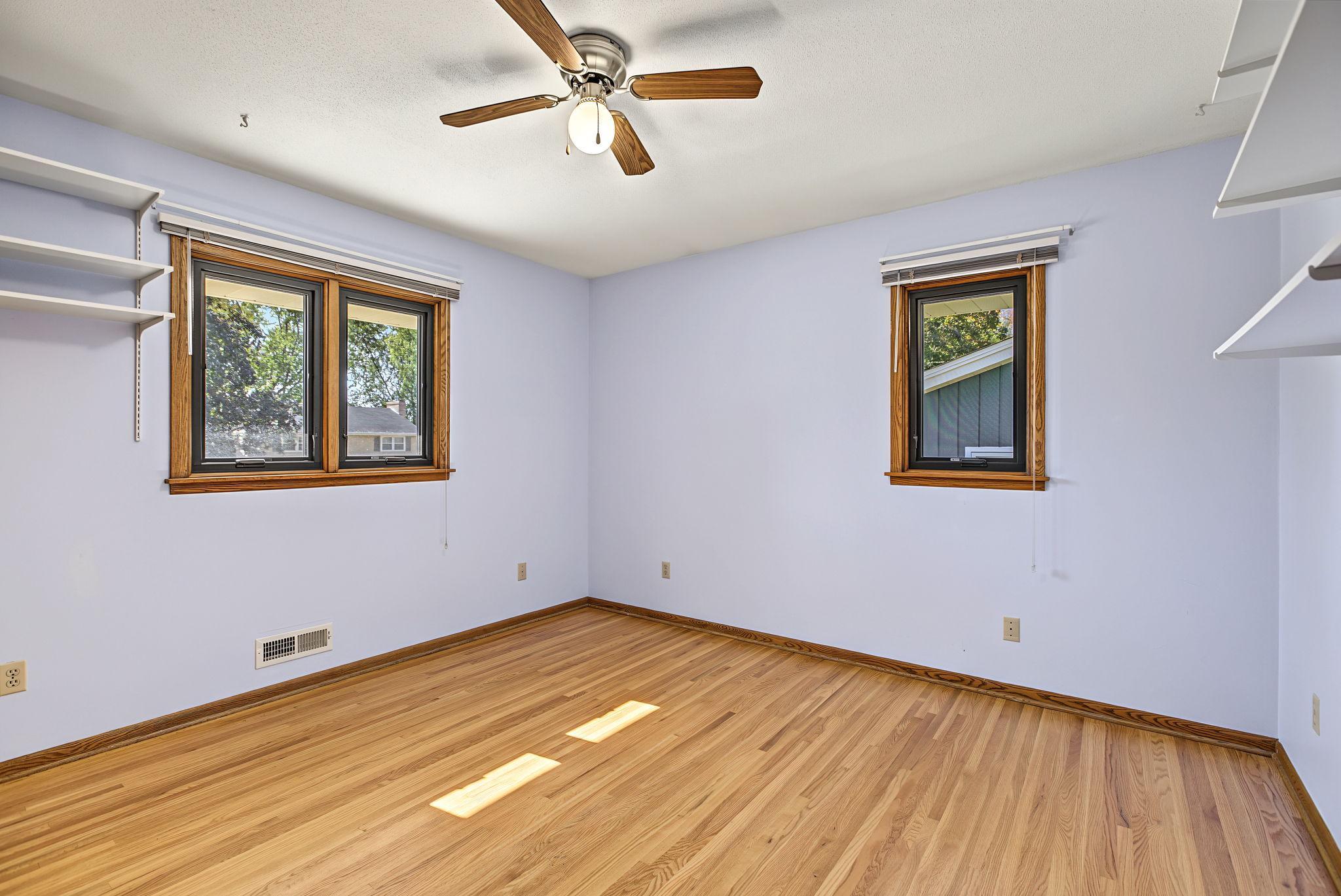 Second bedroom on upper level also has refinished hardwood floors.
