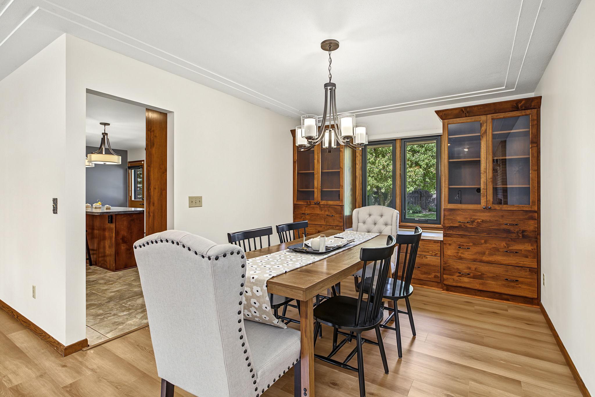 Dining room is adjacent to kitchen and offers so much storage with built-in cabinets.