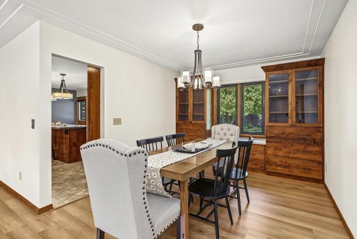 Dining room is adjacent to kitchen and offers so much storage with built-in cabinets.