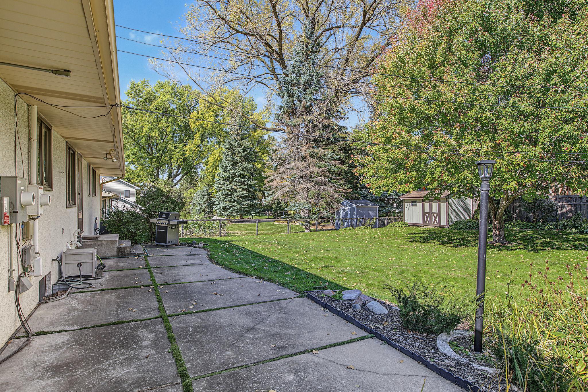 Plenty of room on this concrete patio to entertain - gas grill included!