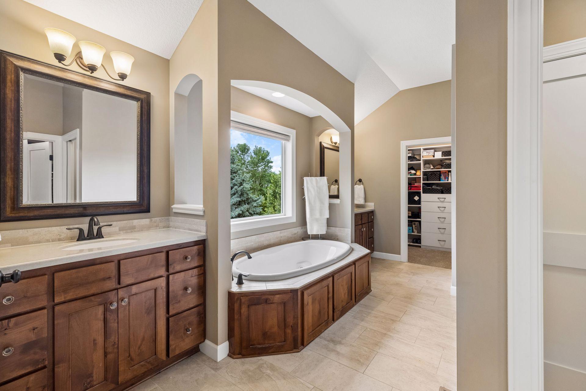 Private owner's bath - his and hers walk-in closets