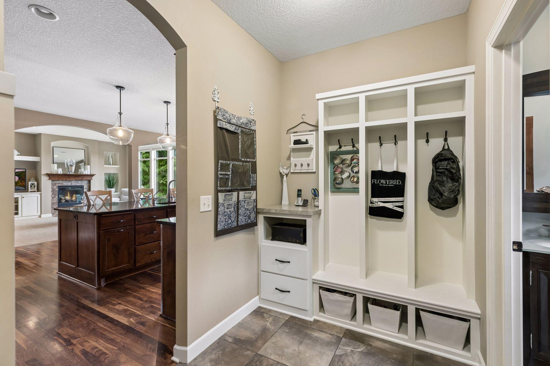 Mudroom with custom built-in lockers and key drop