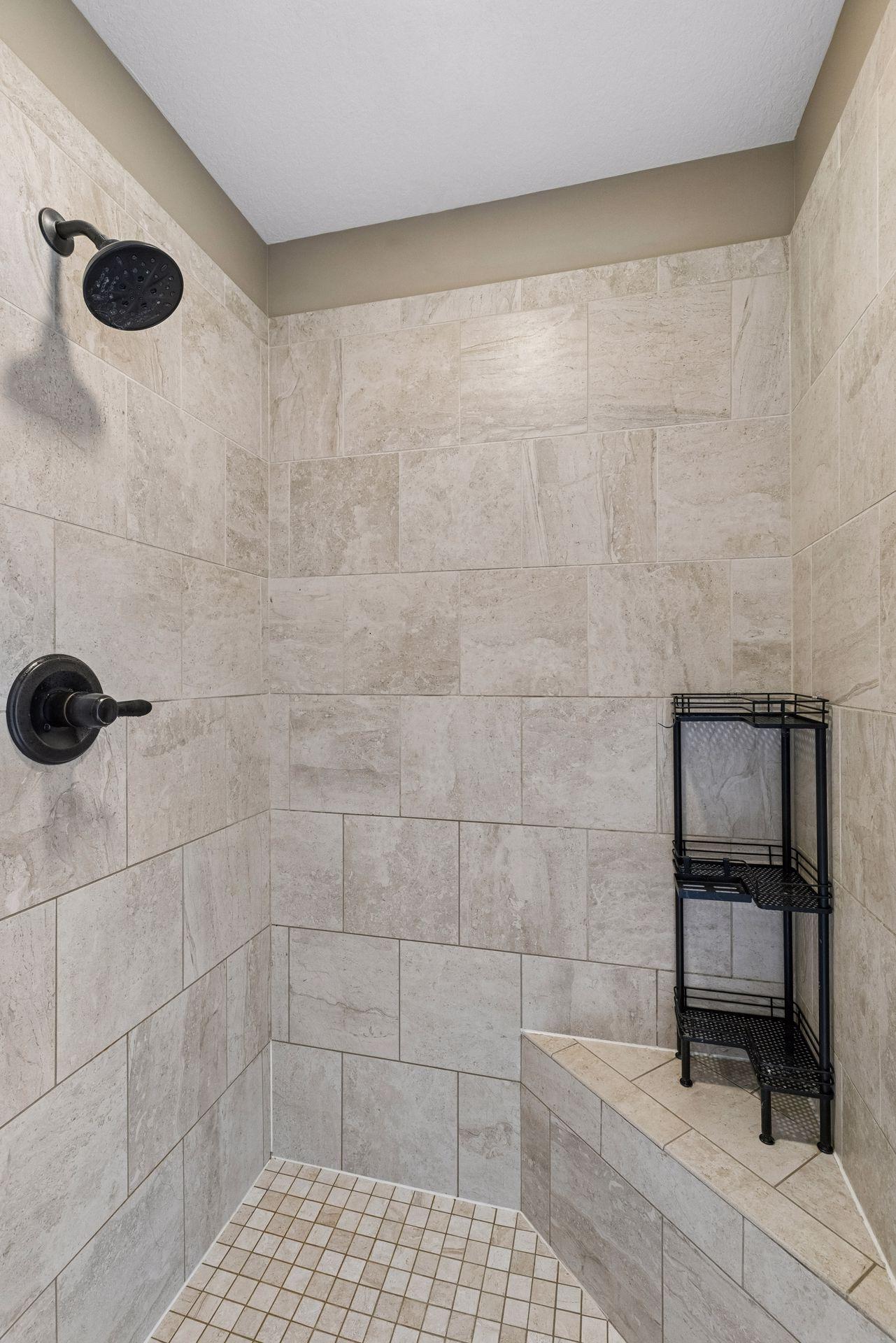 Fully-tiled owner's walk-in shower