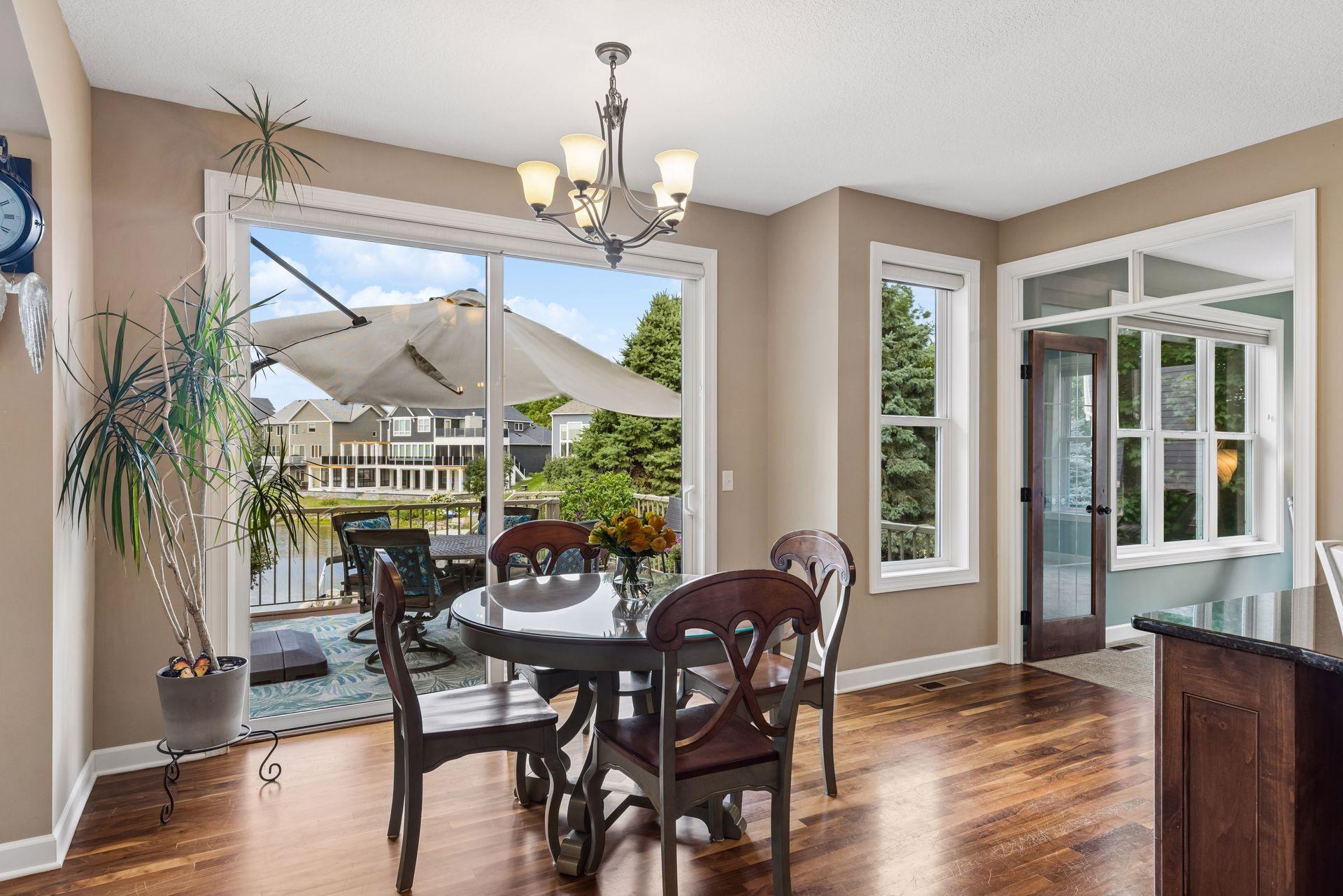 Informal dining walks out to deck through over-sized sliding door