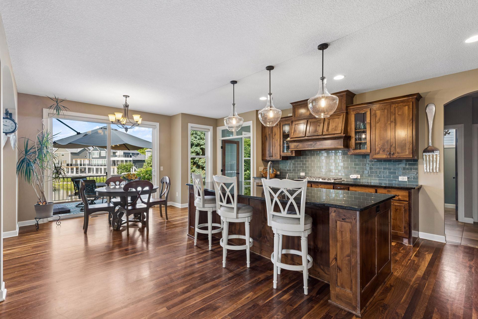 Open kitchen with island and informal dining space