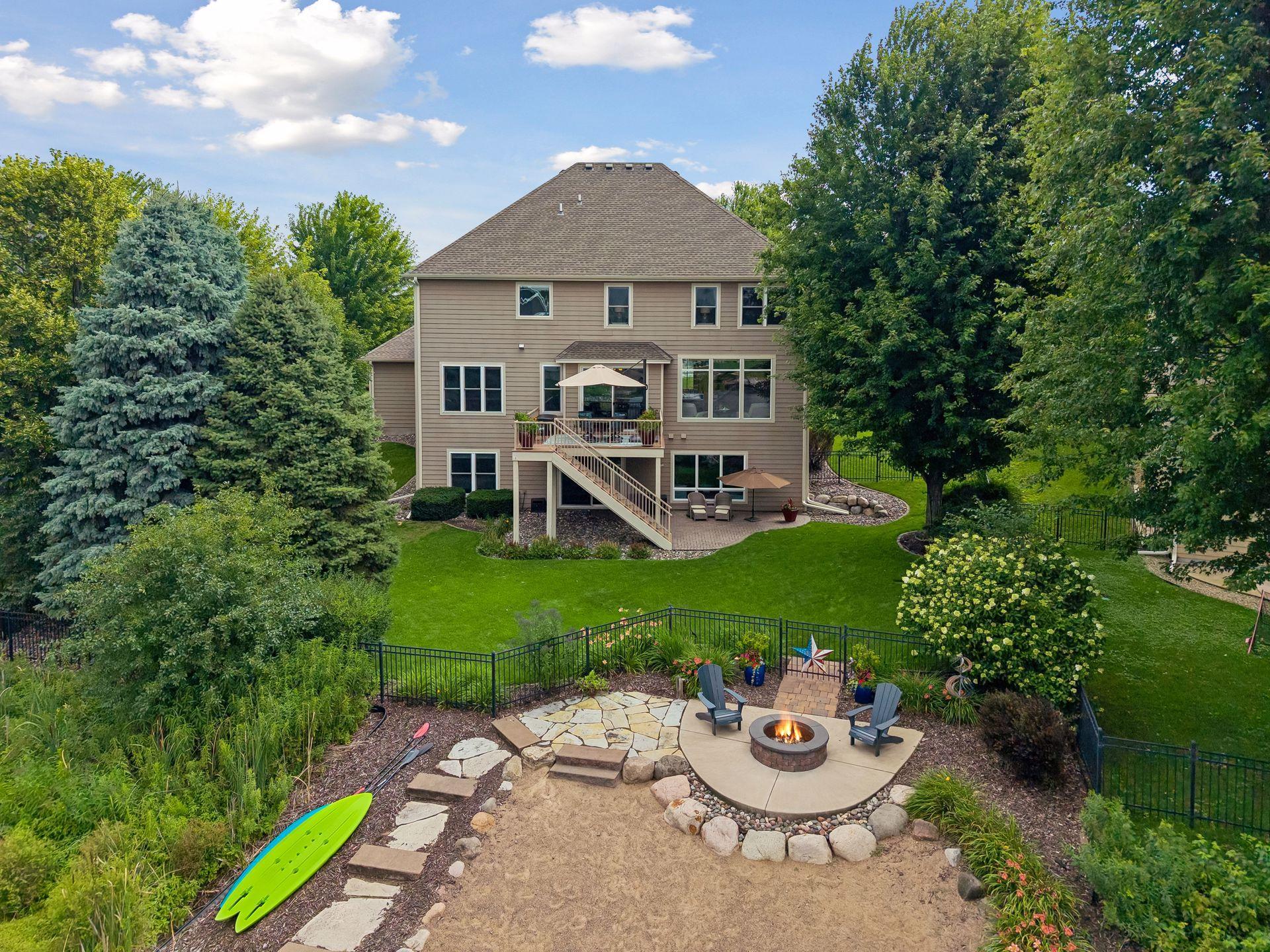 Fully-fenced rear yard with beach and firepit