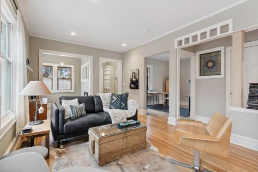 Large open living space with an office and a sunroom