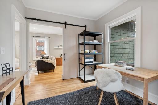 Main floor bedroom opens to living space but has large door for privacy.