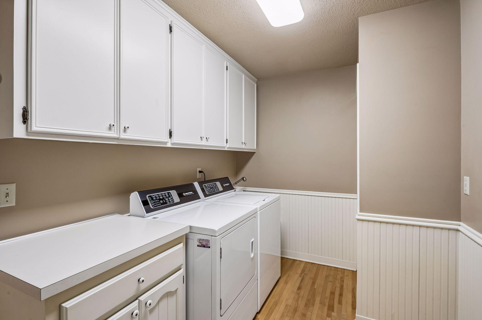1st floor laundry with new Speed Queen machines. Two closets off garage entry