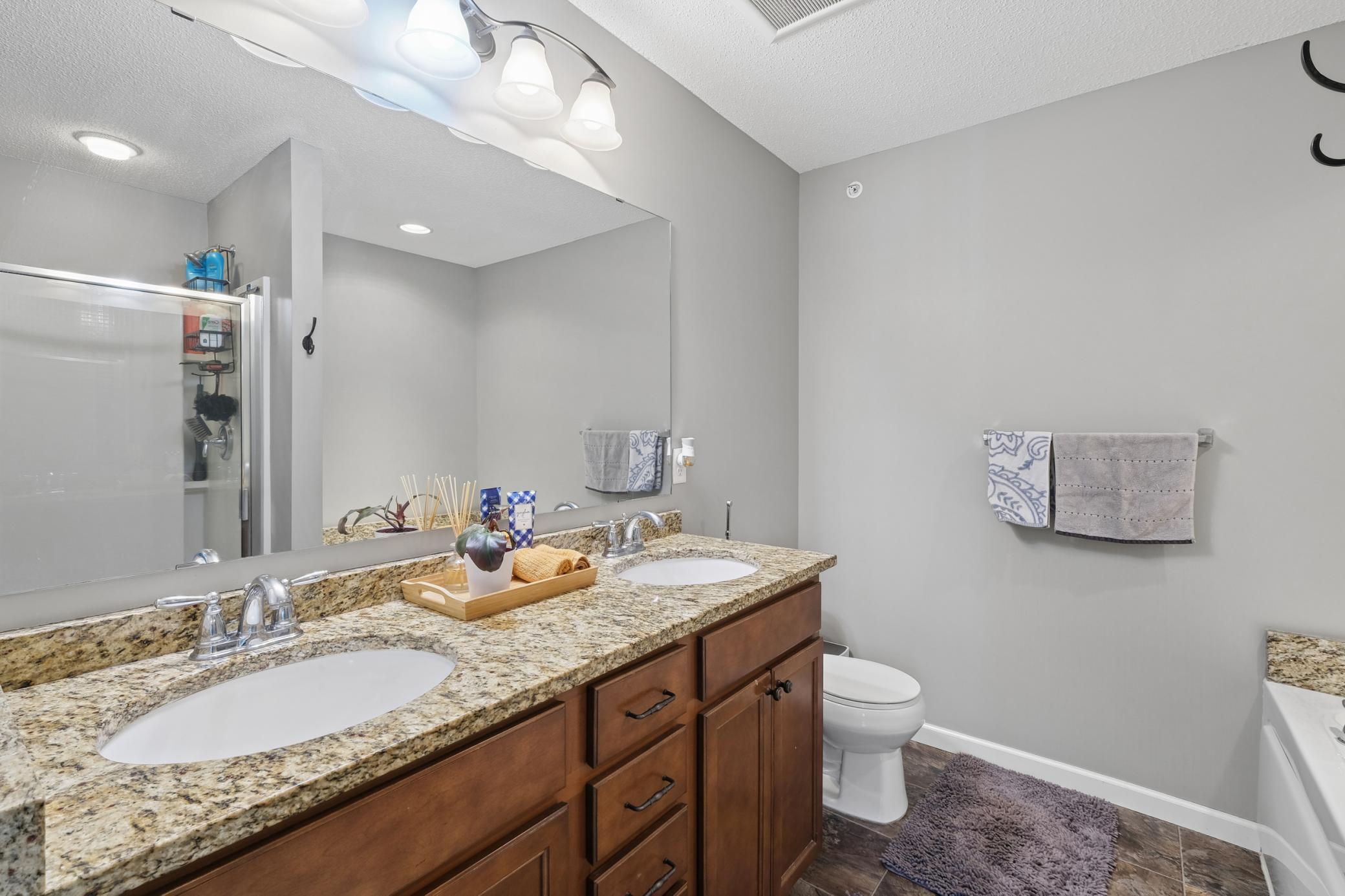 Primary bath with double vanity, oversized soaking tub and standing shower
