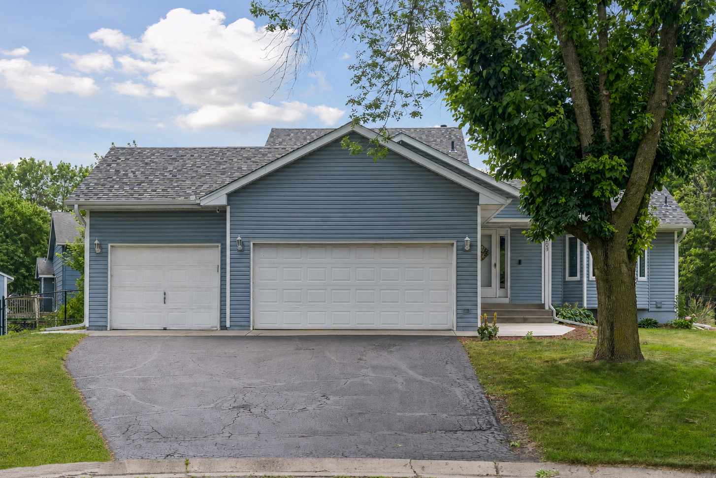 3-car heated garage! (Driveway virtually modified to remove garbage cans)