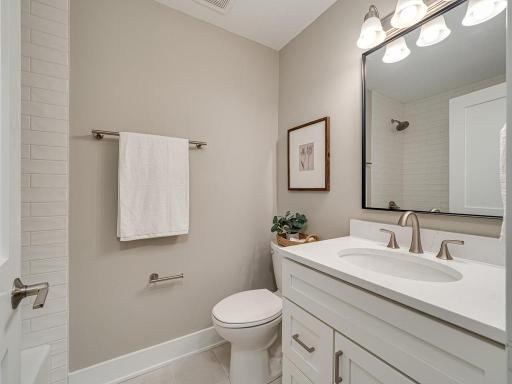 Spa-inspired style meets everyday functionality with beautiful custom tile work, new cabinetry, and modern finishes.