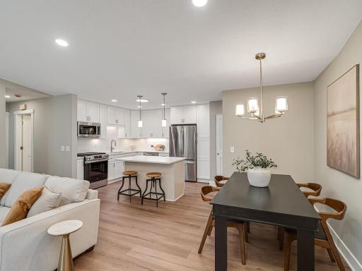 Beautiful Shaw Ascent luxury vinyl plank flooring flows throughout the home, creating a cohesive and sophisticated look.