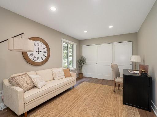 Designed with flexibility in mind, this beautifully renovated second bedroom offers the perfect blend of comfort and function. New Andersen windows, recessed lighting, updated flooring, ideal as a bedroom, home office, or flex room.
