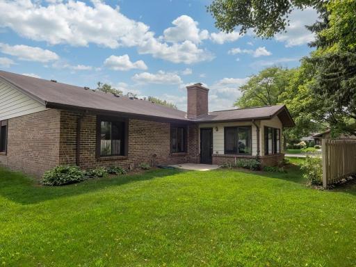 A spacious backyard offers plenty of room to enjoy the outdoors, along with a charming patio that’s perfect for relaxing or entertaining.