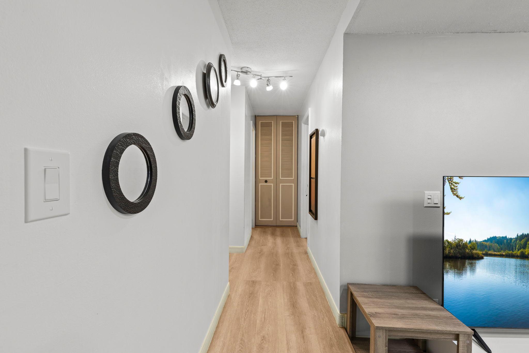 The hallway provides convenient access to the bedrooms and bathroom.