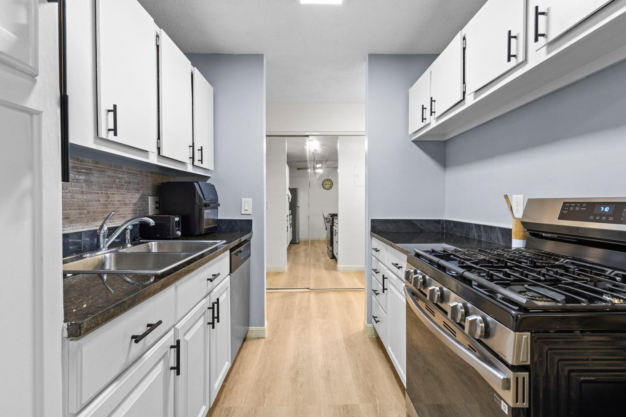 Step inside this well-maintained and thoughtfully updated home featuring luxury plank flooring that extends throughout the kitchen and dining areas.