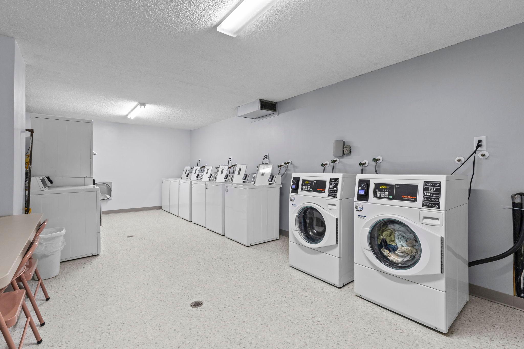 Community laundry room offering convenient access to on-site laundry facilities.