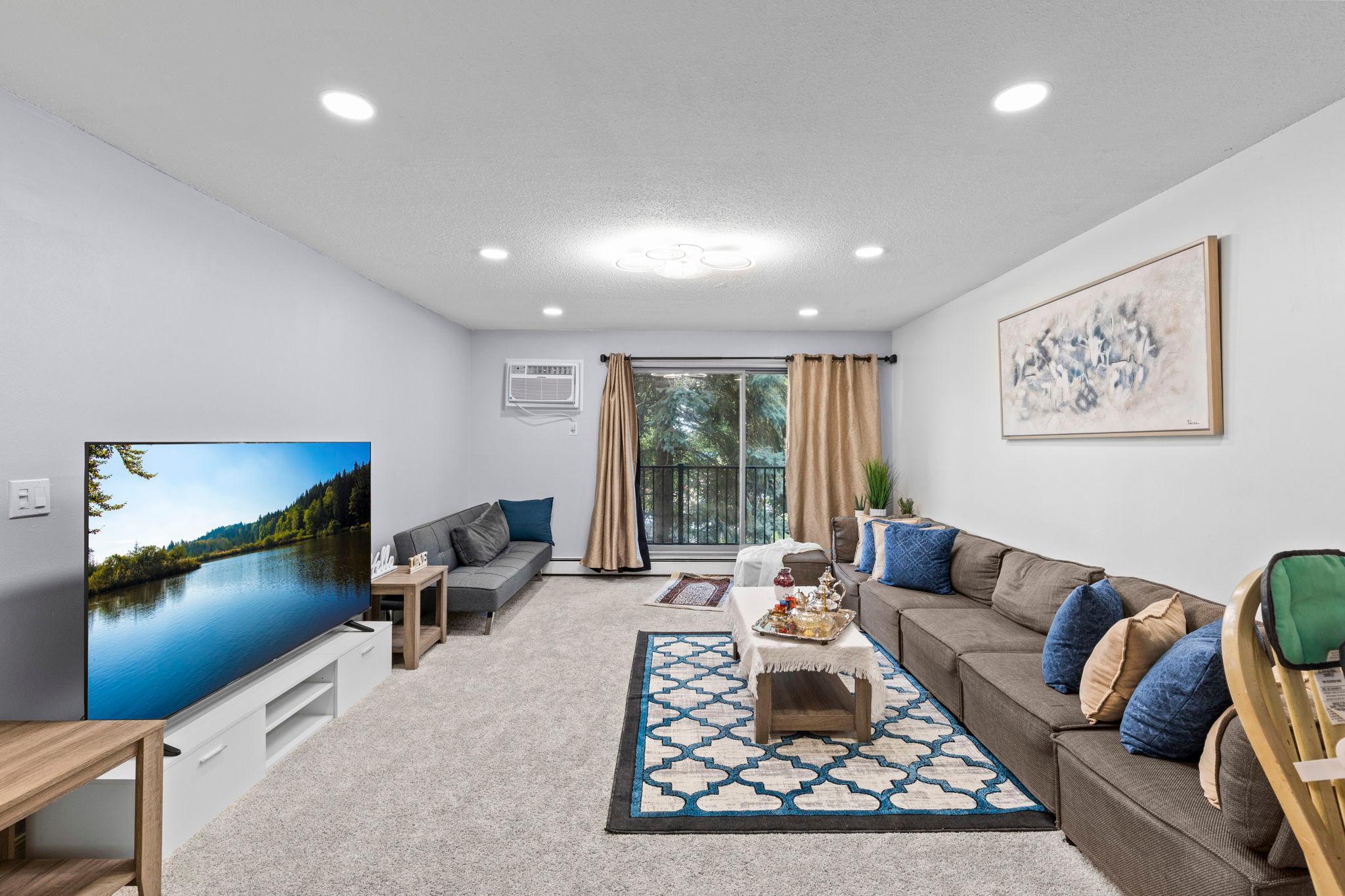 An alternate view of the spacious living room showcasing the open layout and inviting atmosphere.