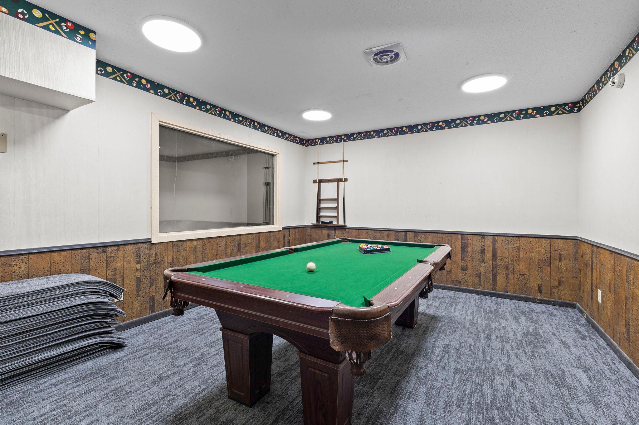 Pool table recreation space providing a fun area for entertaining.
