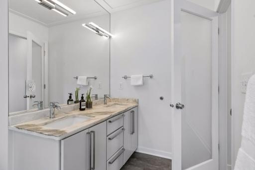 Frosted glass doors carry throughout the home, for an elevated look.