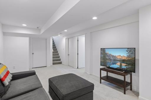 Lower level includes a large storage room and utility room.
