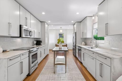 Modern kitchen with custom handmade tile backsplash by Heath Ceramics (2026).
