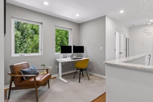 White marble banister and landing area, perfect for home office or reading nook.