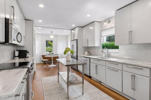 White marble countertops carry throughout the home, to create a clean and cohesive look.