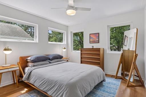 Second of three bedrooms upstairs, with four large windows for natural light.