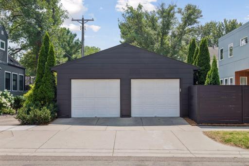 Oversized two-car garage, repainted in 2025, with electric vehicle charger outlet.