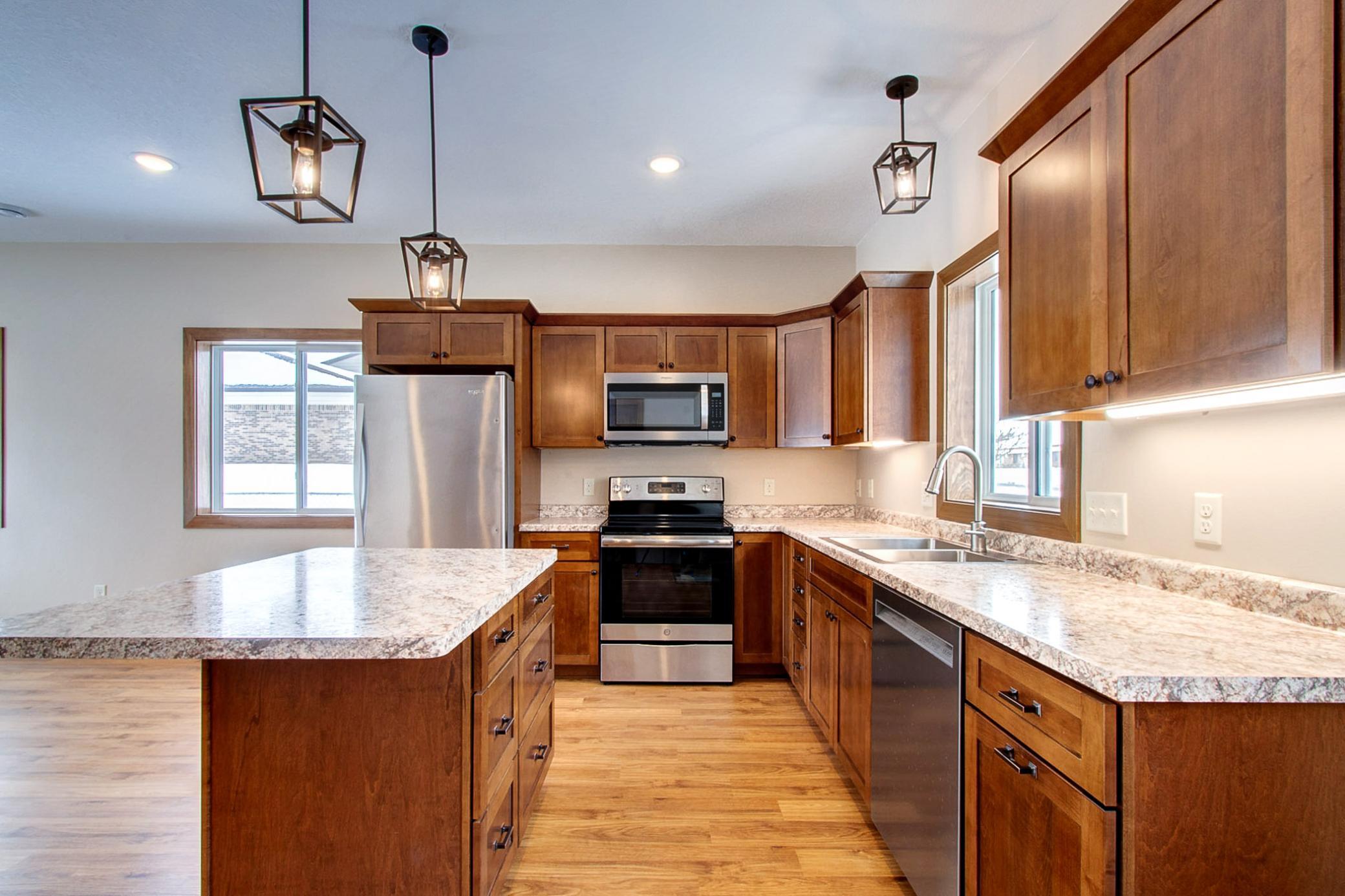 Spacious kitchen has soft close cabinets, convenient island and lots of storage including a pantry!