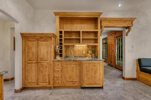 Built in beverage station with sub-zero drink refrigerator.