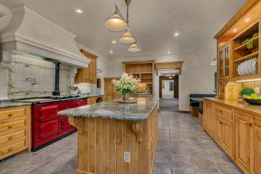 Large granite center island for hosting, prepping and plenty of additional storage.