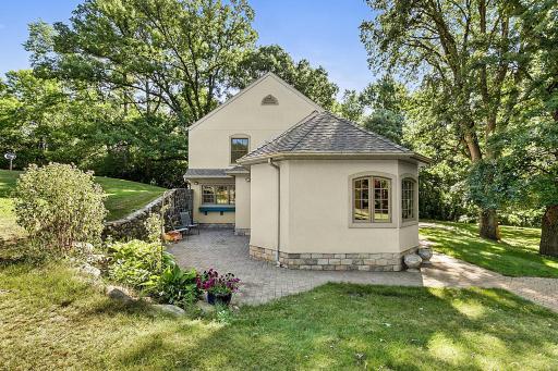 Enjoy back patio off the french country inspired kitchen.