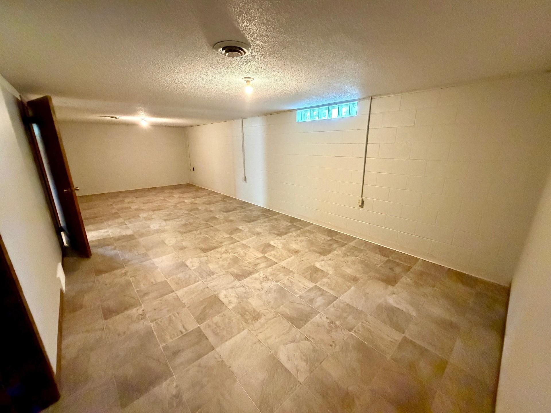 Lower level recreation room perfect for entertaining.jpg