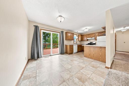 Dining area with sliding glass door leading to the backyard deck.