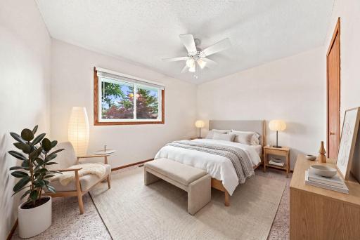 Second main-level bedroom with generous closet space and bright window.